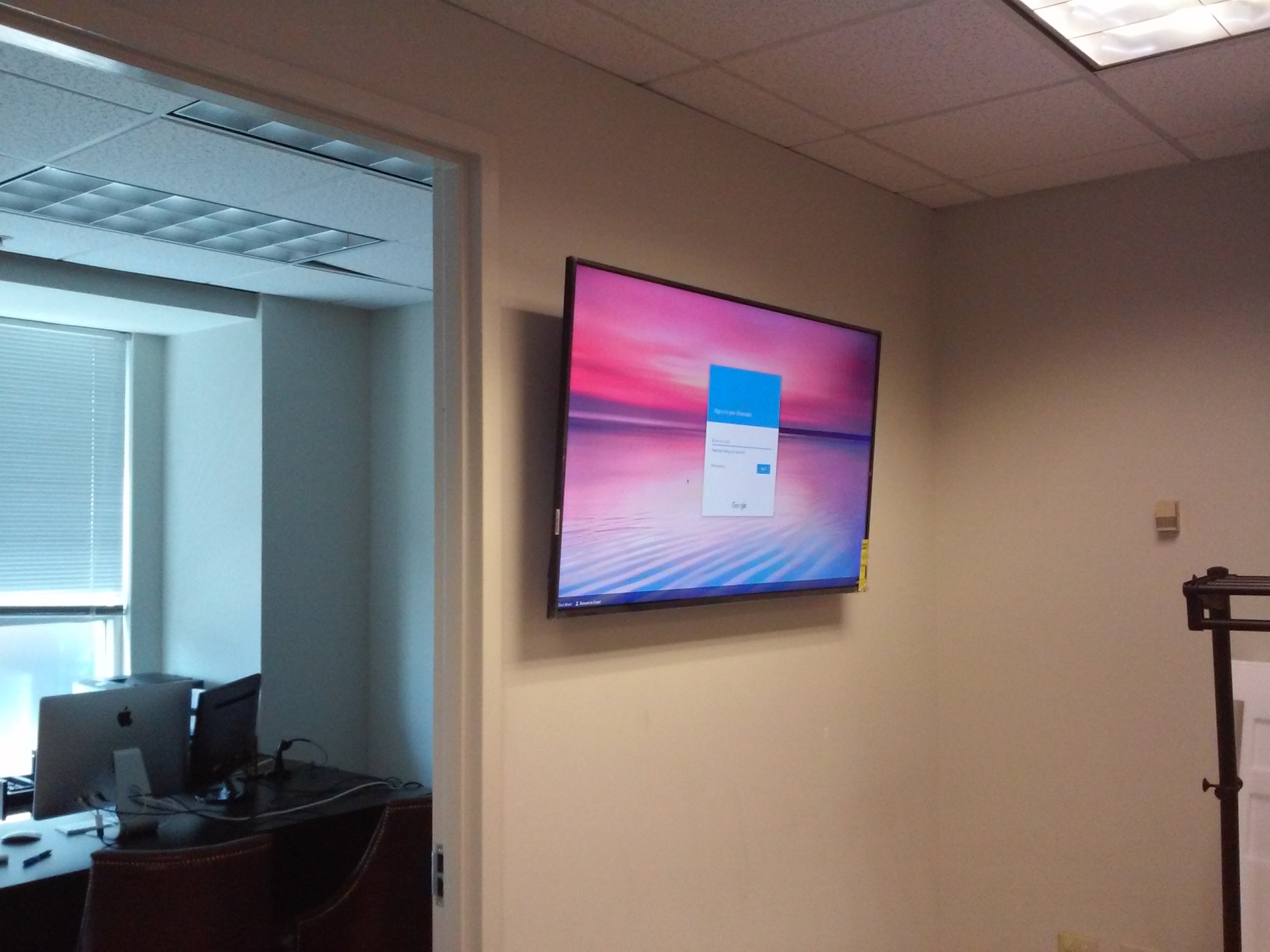Atlanta Pro Repairs — flat-panel TV mounted cleanly in a Sandy Springs office meeting room