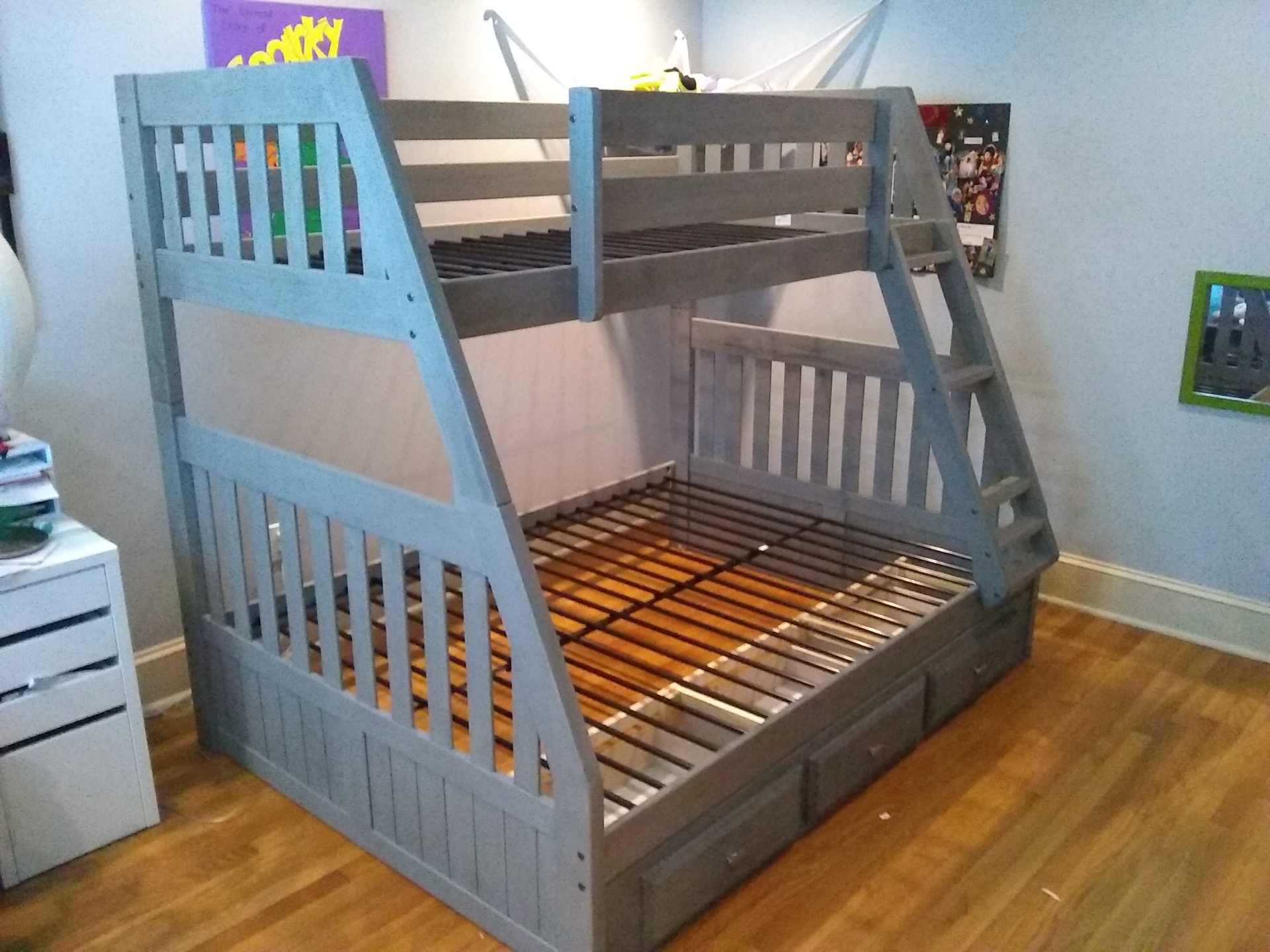 Atlanta Pro Repairs — grey twin-over-full bunk bed fully assembled and placed in a kids room